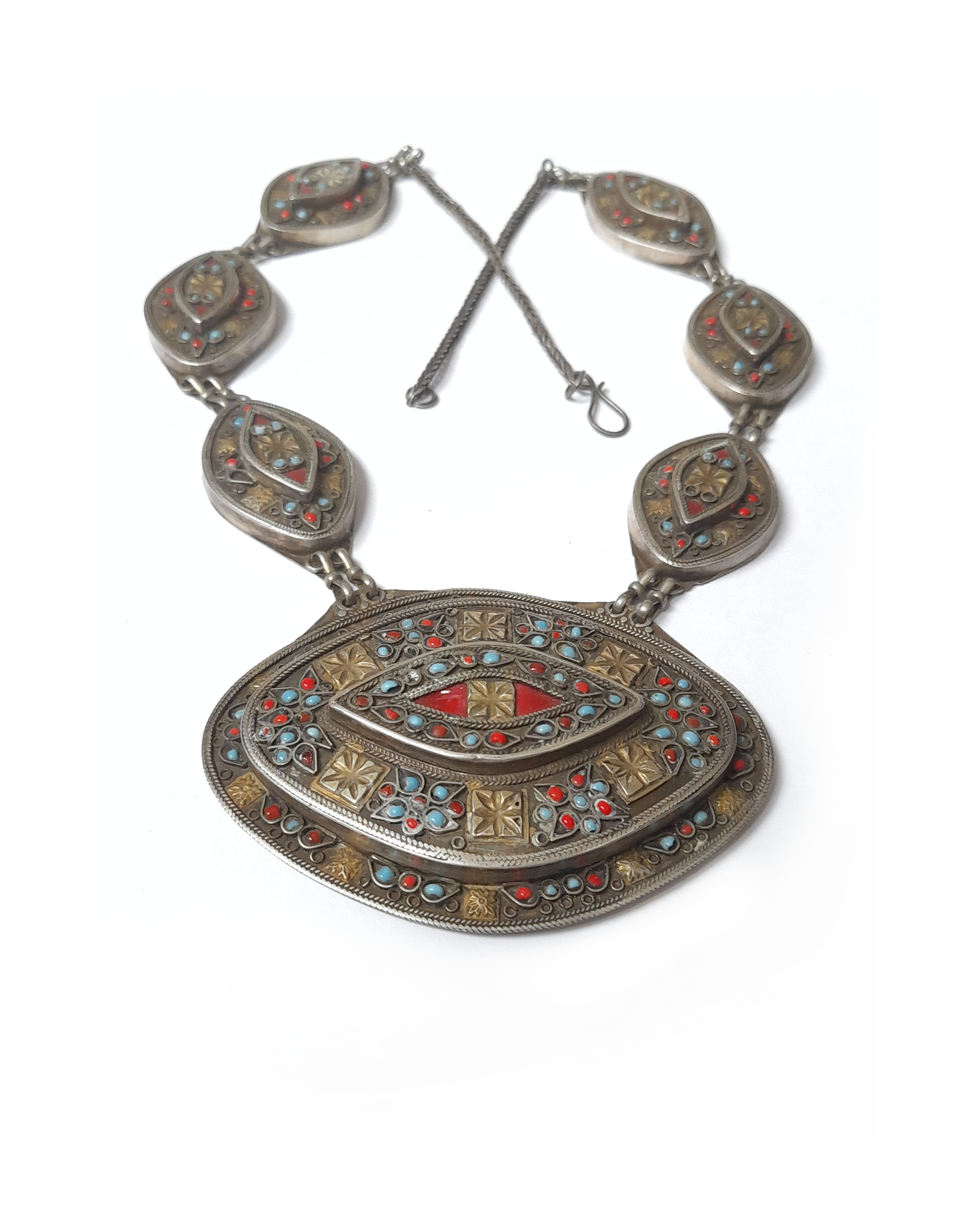 Antique silver Turkmen necklace, its silver elements carry small inlaid glass red and turquoise colored beads and has smaller gilded silver elements