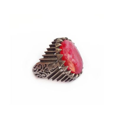 Ethnic silver and ruby root statement ring. Its silver setting shows exquisite Afghan silver work and the ruby root gem is of a beautiful purple/pink color, shiny and faceted, which reflects the light in a lovely way.