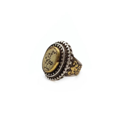 Chunky silver and gilded silver Afghan statement ring with Arabic calligraphy. It's brass top shows writing in Arabic letters.
